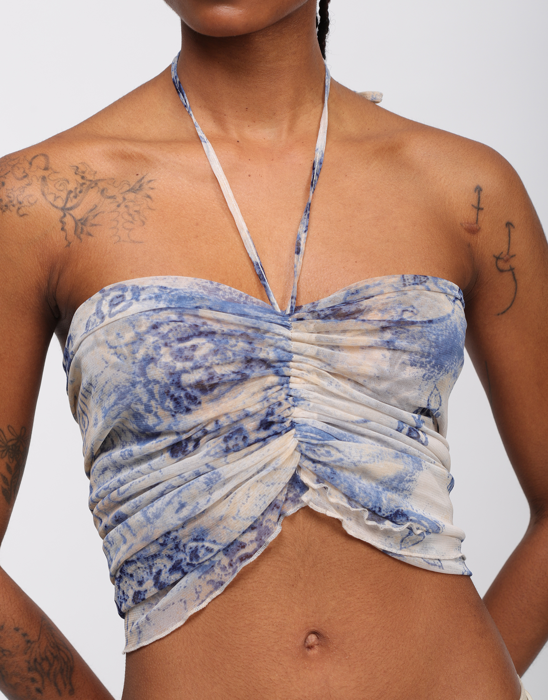 Draped top in blue and beige printed tulle